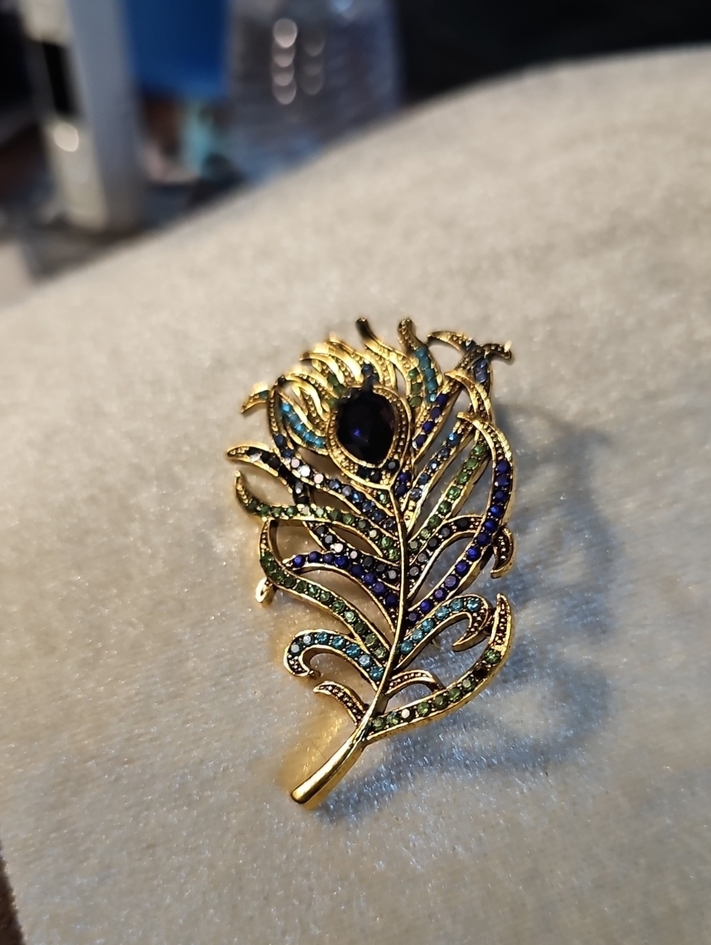 Gold Peacock Feather Brooch with Blue and Green Accents